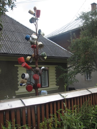 This tree is either just used to dry pots or signifies that there is an available lady living in the house