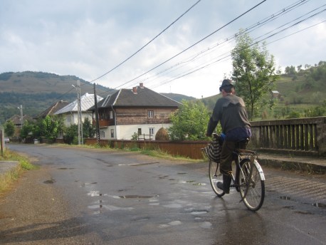 Coming back from the fields, you can see his scythe attached to his bike