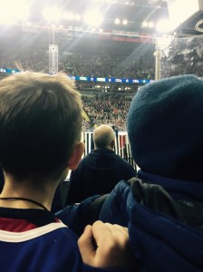 Kids in my lap at the end trying to high five players and get sticks